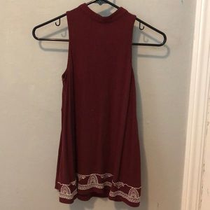 a long shirt with tight neck and a loose bottom